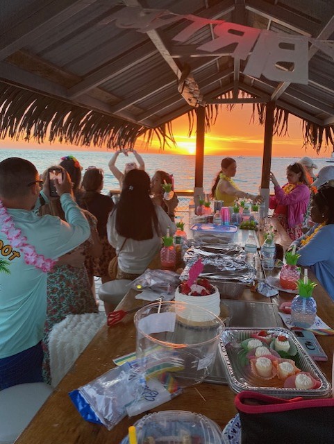 Guests enjoying a bespoke beach and sandbar charter experience